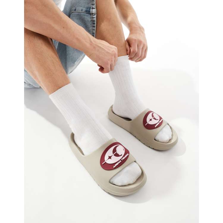 ASOS DESIGN stone sliders with burgundy badge ASOS