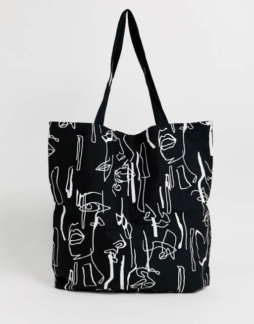 ASOS DESIGN - Stor shoppertaske med abstrakt ansigtsprint