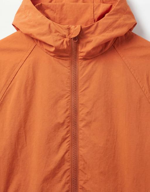 ASOS DESIGN stormMAX™ water repellent packaway rain jacket in orange, 8 of 9