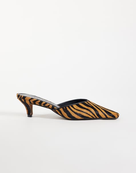 ASOS DESIGN Stormy hair on real leather chisel toe heeled mules in tiger - view 1