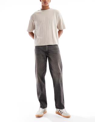 ASOS DESIGN straight fit jeans with yellow tint in washed black