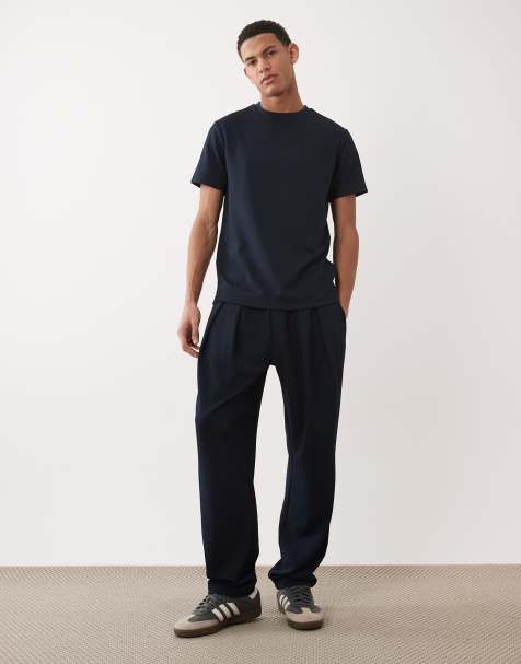 ASOS DESIGN straight leg jacquard trackies in navy - view 1