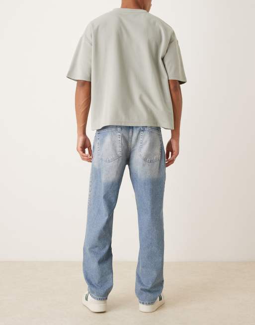 ASOS DESIGN straight leg jeans in mid wash blue with rips