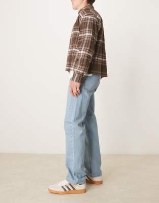ASOS DESIGN straight leg jeans in mid wash blue