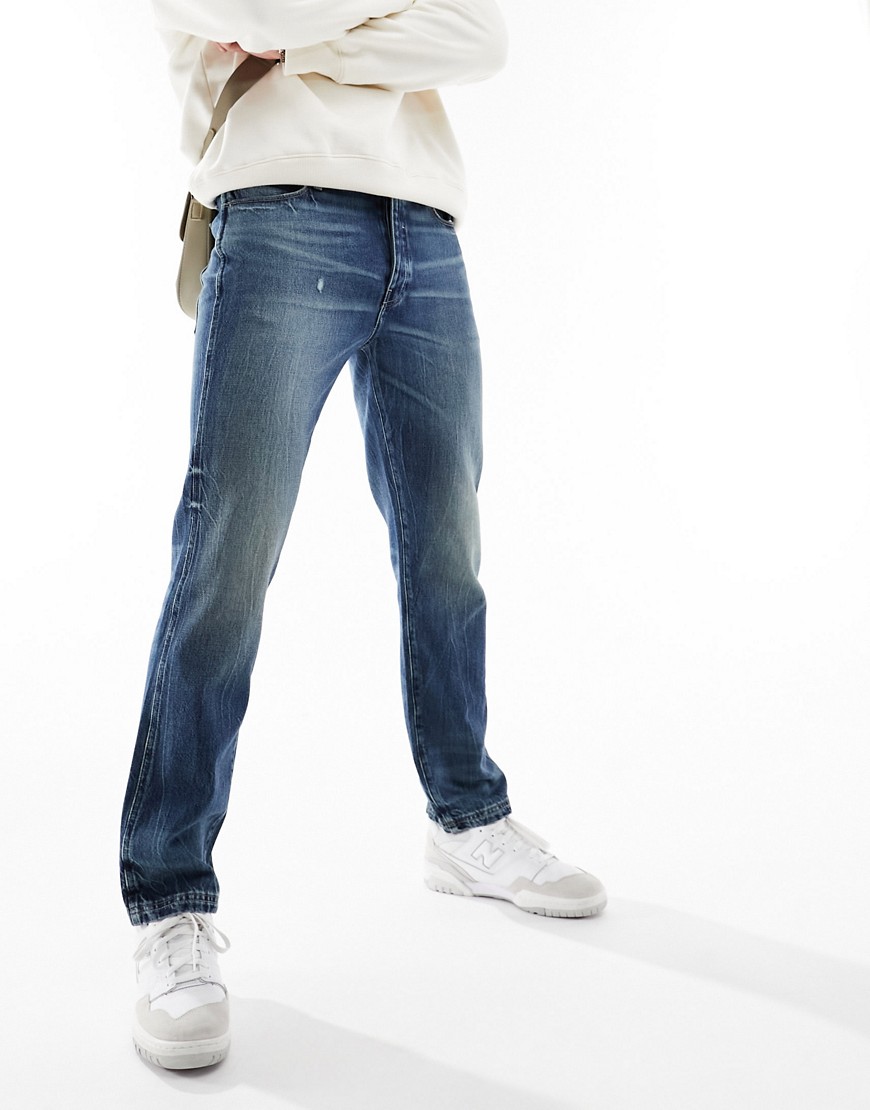 ASOS DESIGN straight leg jeans in vintage mid wash blue