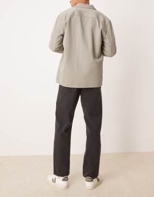 ASOS DESIGN straight leg jeans in washed black 