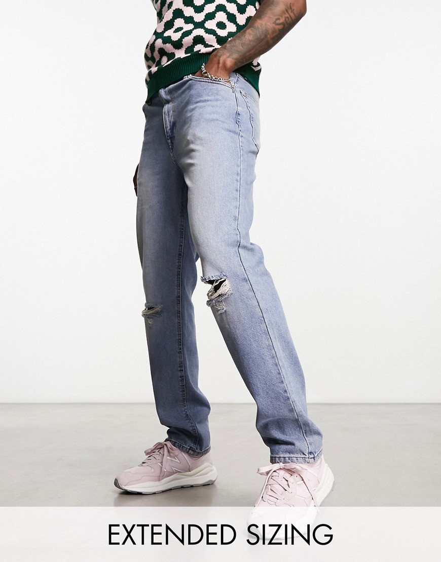 ASOS DESIGN straight leg jeans with busted knee in mid blue wash