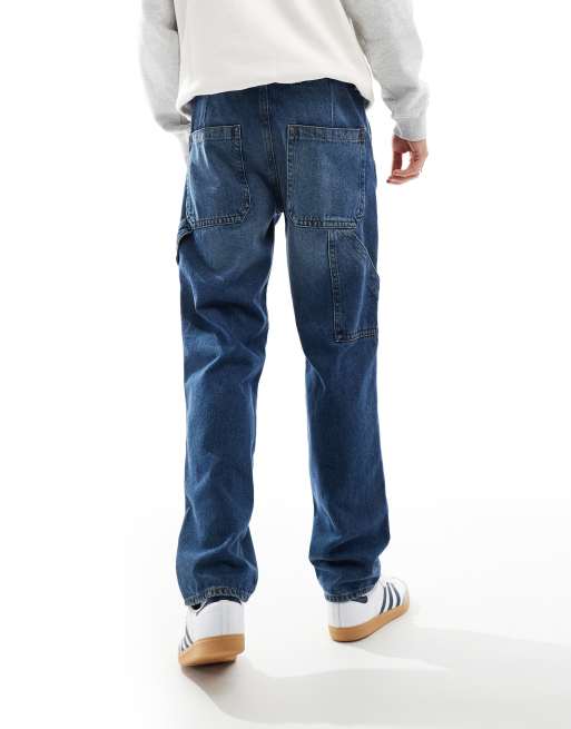 ASOS DESIGN straight leg jeans with carpenter detail in mid