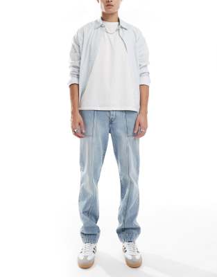 straight leg jeans with paneling detail in light wash blue