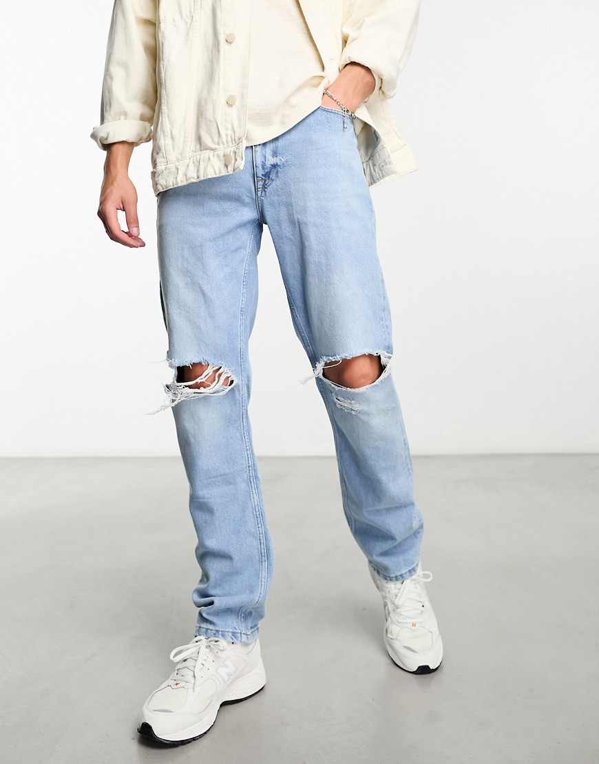 ASOS DESIGN straight leg jeans with rips in light blue wash