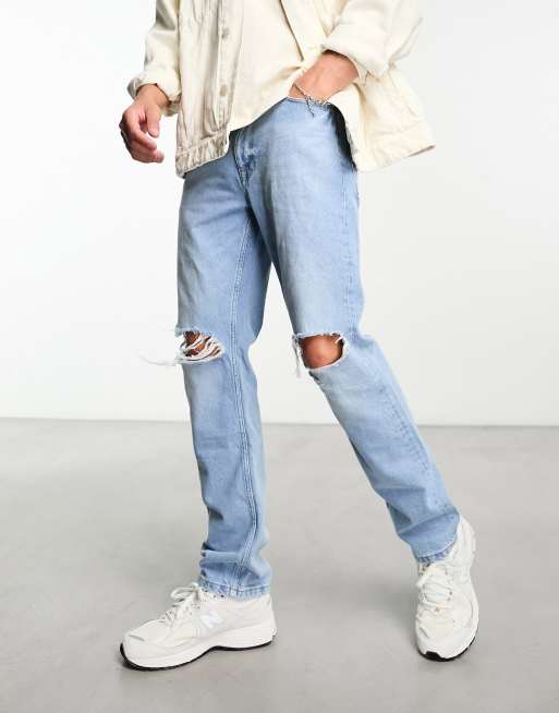 ASOS DESIGN straight leg jeans with rips in light blue wash