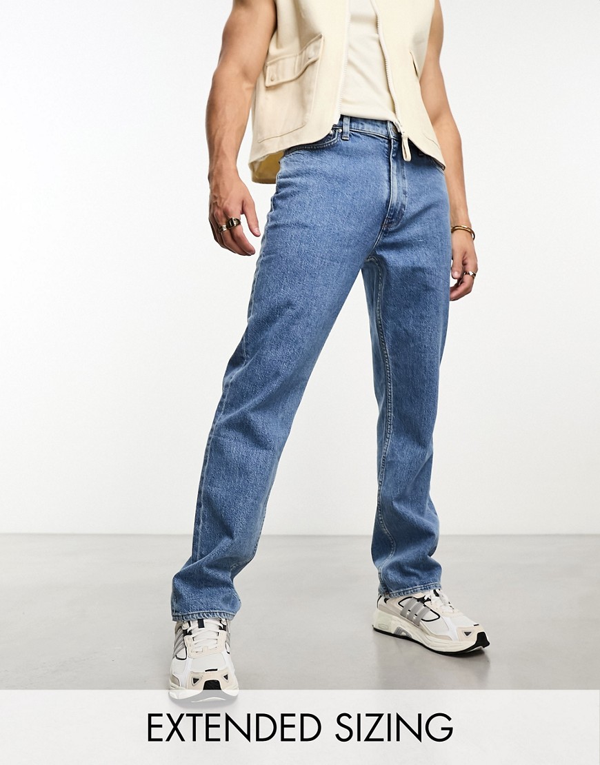 ASOS DESIGN straight leg jeans with stretch in mid wash blue