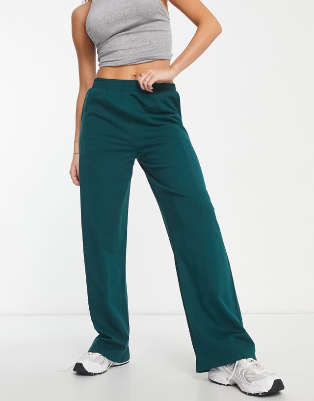 ASOS DESIGN straight leg sweatpants in dark green