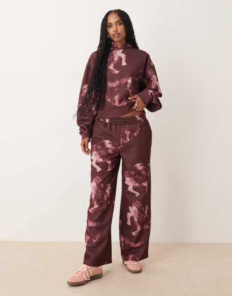 ASOS DESIGN straight leg sweatpants with all-over floral design in plum - part of a set - view 1