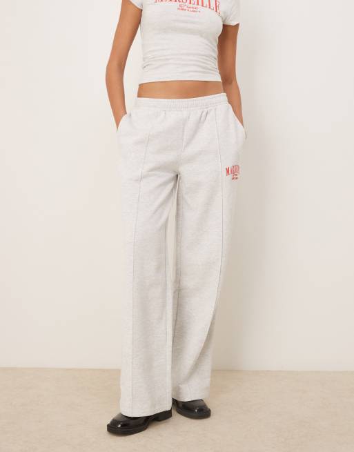 ASOS DESIGN straight leg sweatpants with Marseille embroidered graphic in ice heather, 2 of 5