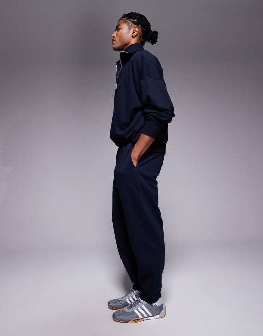 ASOS DESIGN straight leg sweatpants with pleats in navy