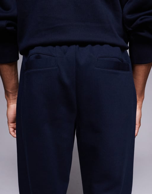 ASOS DESIGN straight leg sweatpants with pleats in navy