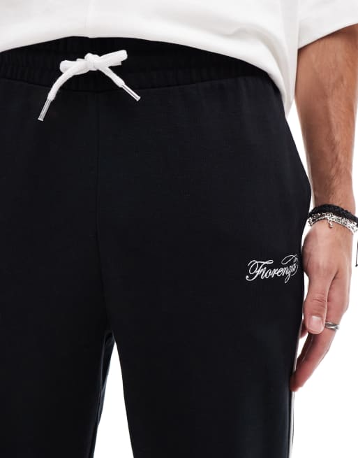 ASOS DESIGN straight leg trackies with embroidery and tipping details ...