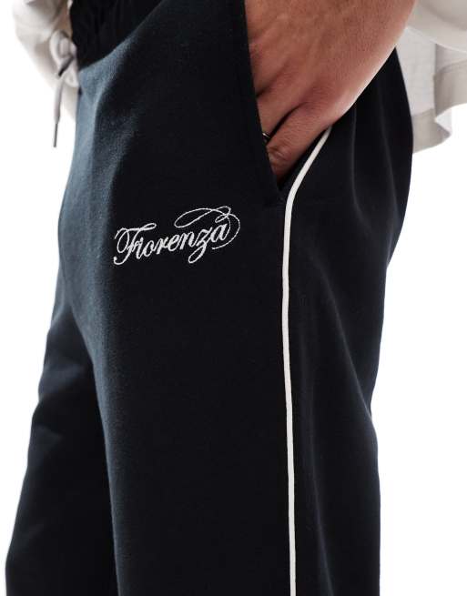 ASOS DESIGN straight leg trackies with embroidery and tipping details ...