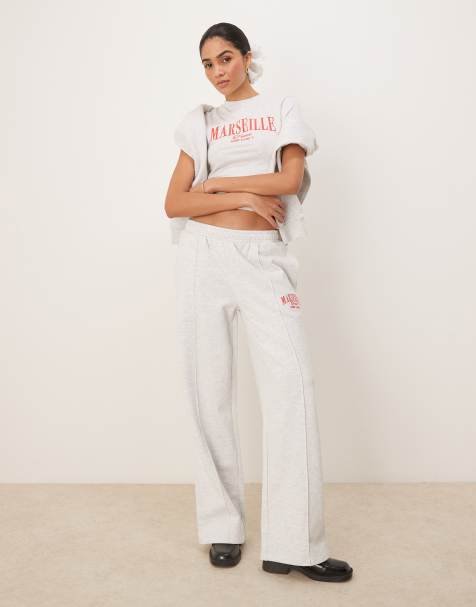 ASOS DESIGN straight leg trackies with Marseille embroidered graphic in ice marl - view 1