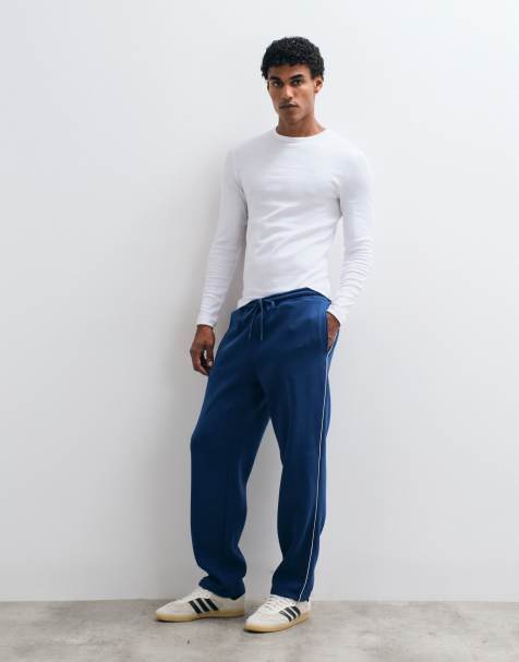 ASOS DESIGN straight leg trackies with piping in blue - view 1