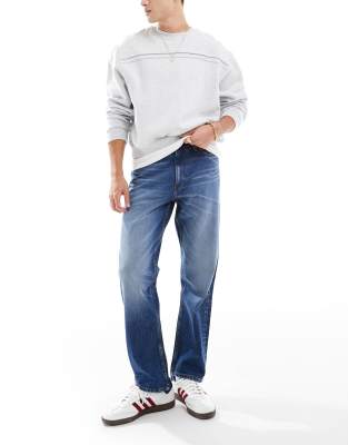 straight stretch jeans in mid blue wash