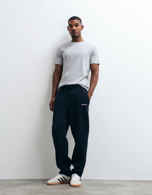 ASOS DESIGN straight trackies with pigment print in navy, 2 of 5