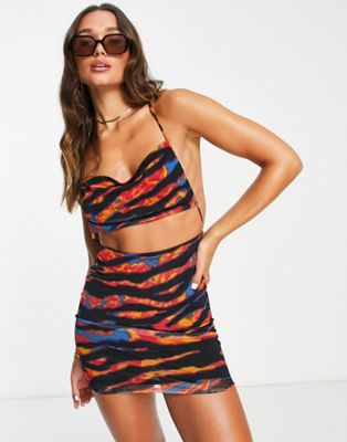 ASOS DESIGN strappy cut out mini dress in blue and orange abstract animal