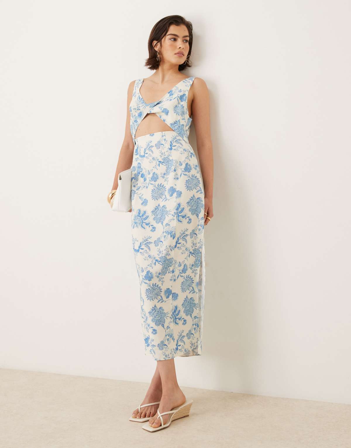 ASOS DESIGN strappy twist bust detail cut out midi dress in floral print