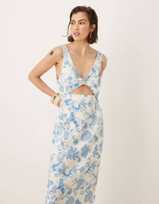 ASOS DESIGN strappy twist bust detail cut out midi dress in floral print