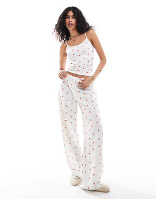 ASOS DESIGN strawberry ditsy wide leg trousers in white-Multi