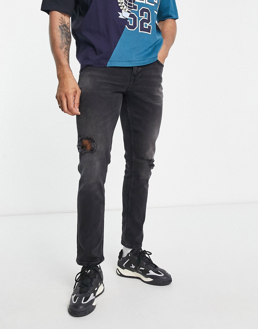 ASOS DESIGN strech slim jeans in washed black with abrasions