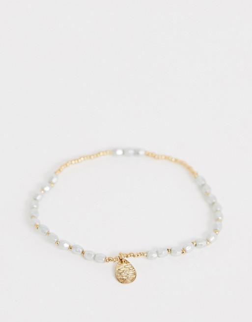 ASOS DESIGN stretch bracelet with mini faux freshwater pearls and hammered teardrop charm in gold tone