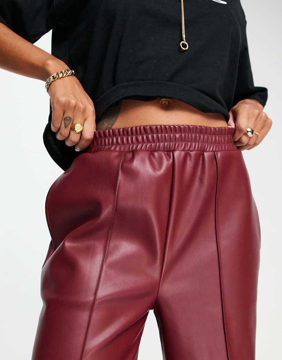 ASOS DESIGN stretch faux leather straight jogger trouser in wine