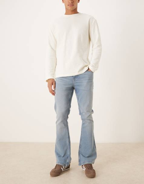 ASOS DESIGN – Stretch-Schlagjeans in verwaschenem Mittelblau - view 1