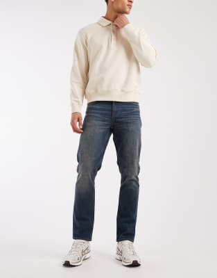 ASOS DESIGN stretch slim fit jeans in vintage mid wash blue | ASOS