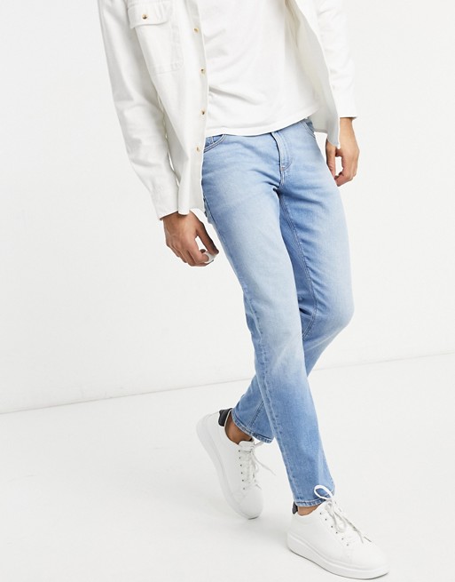 ASOS DESIGN stretch slim jeans in light wash blue