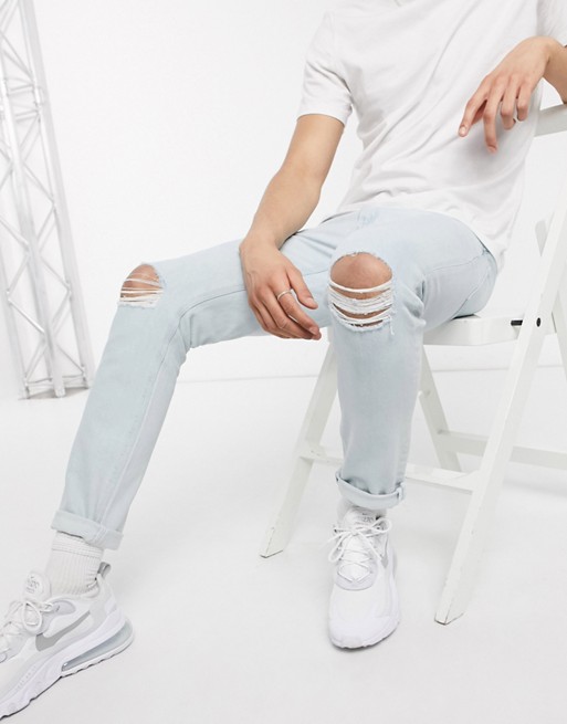 ASOS DESIGN stretch slim jeans in light wash with knee rips