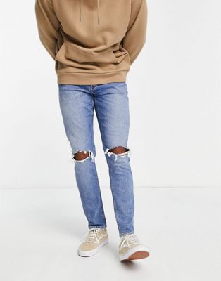 ASOS DESIGN stretch slim jeans in mid wash blue with knee rips - ASOS Price Checker
