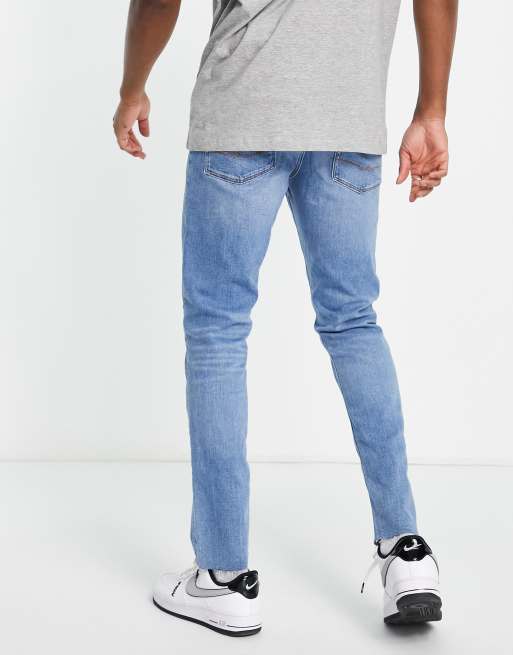 Mens jeans raw on sale hem