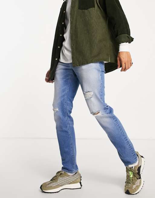 ASOS DESIGN stretch slim jeans in mid wash blue with rips