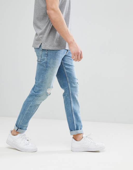 ASOS DESIGN stretch slim jeans in mid wash blue with rips, 2 of 4