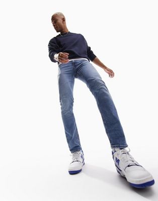 ASOS DESIGN stretch slim jeans in mid wash blue - ASOS Price Checker