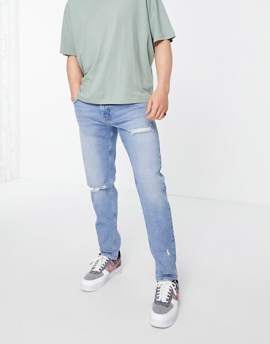 ASOS DESIGN stretch slim jeans in mid wash with rips-Blues