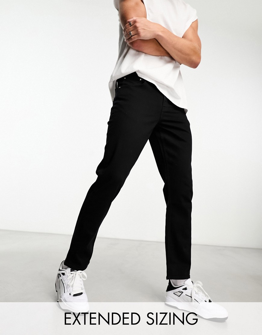 Shop Asos Design Stretch Slim Jeans In No-fade Black