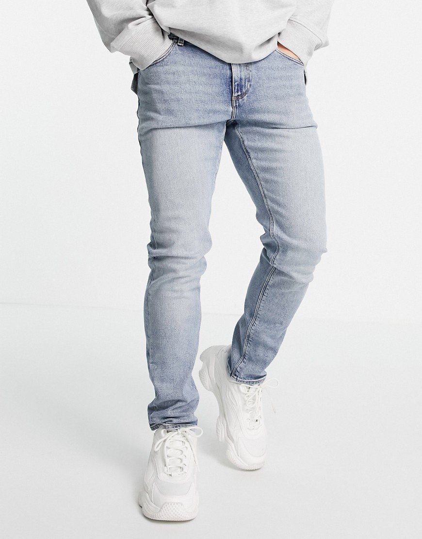 ASOS DESIGN stretch slim jeans in tinted light wash-Blues
