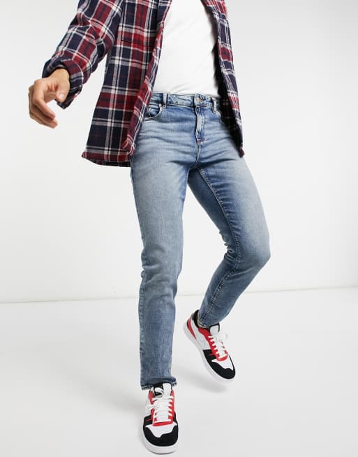ASOS DESIGN stretch slim jeans in tinted mid blue wash