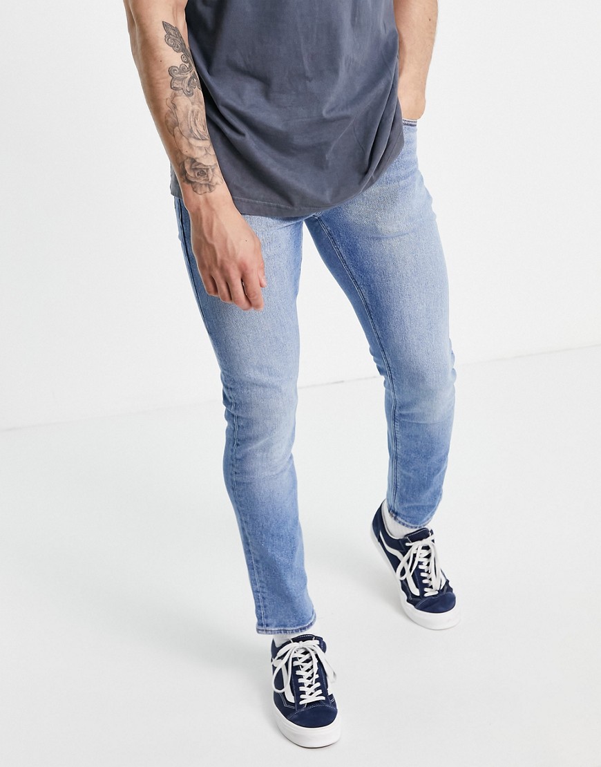 ASOS DESIGN stretch slim jeans in vintage light wash-Blues
