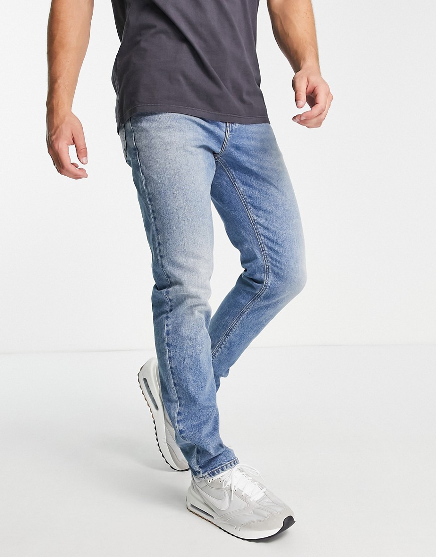 ASOS DESIGN stretch slim jeans in vintage mid wash blue