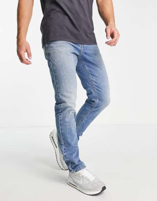 ASOS DESIGN mid rise comfort stretch straight leg jeans in midwash